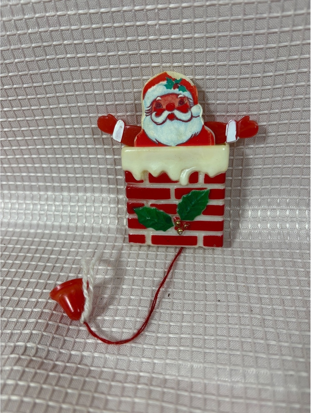 vintage plastic Santa-in-the-chimney pull-string holiday brooch